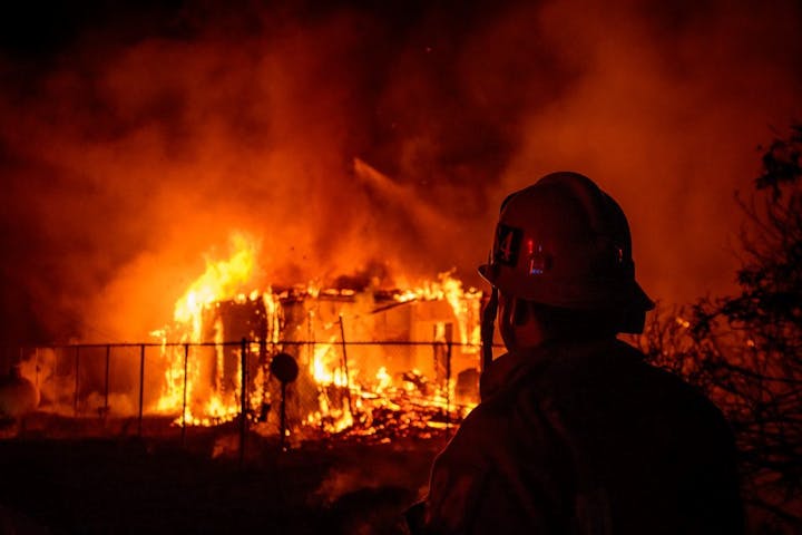 fireman with fire in background