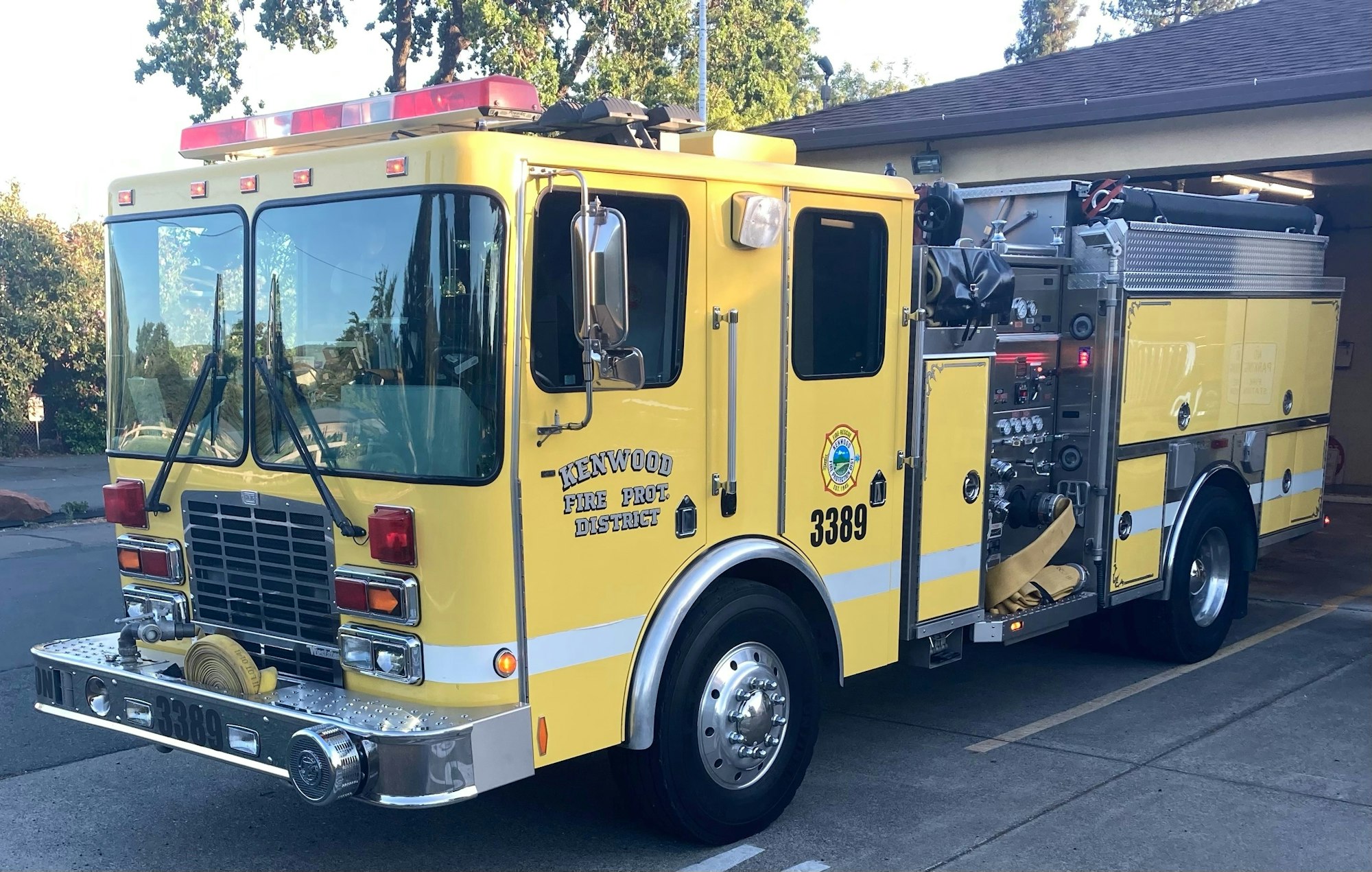 Yellow fire truck marked "Kenwood Fire Prot. District" with number 3389.