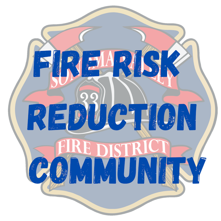 Emblem with text "FIRE RISK REDUCTION" and "FIRE DISTRICT COMMUNITY", a fireman's helmet, and water hose.