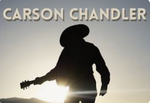 Silhouette of a cowboy with a guitar, sun setting, "CARSON CHANDLER" text above.