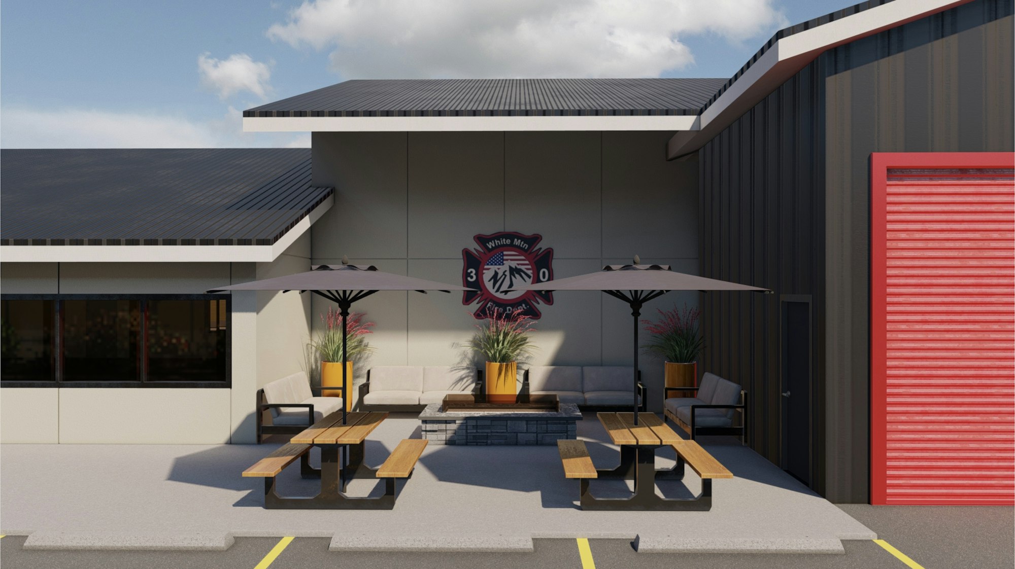 Outdoor seating area with benches, umbrellas, plants, and a fire department emblem on a wall.