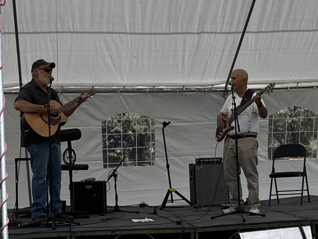 two guys playing guitar