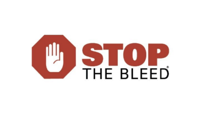 The image features the logo for "STOP THE BLEED," with a hand symbol and an octagonal design promoting bleeding control awareness.