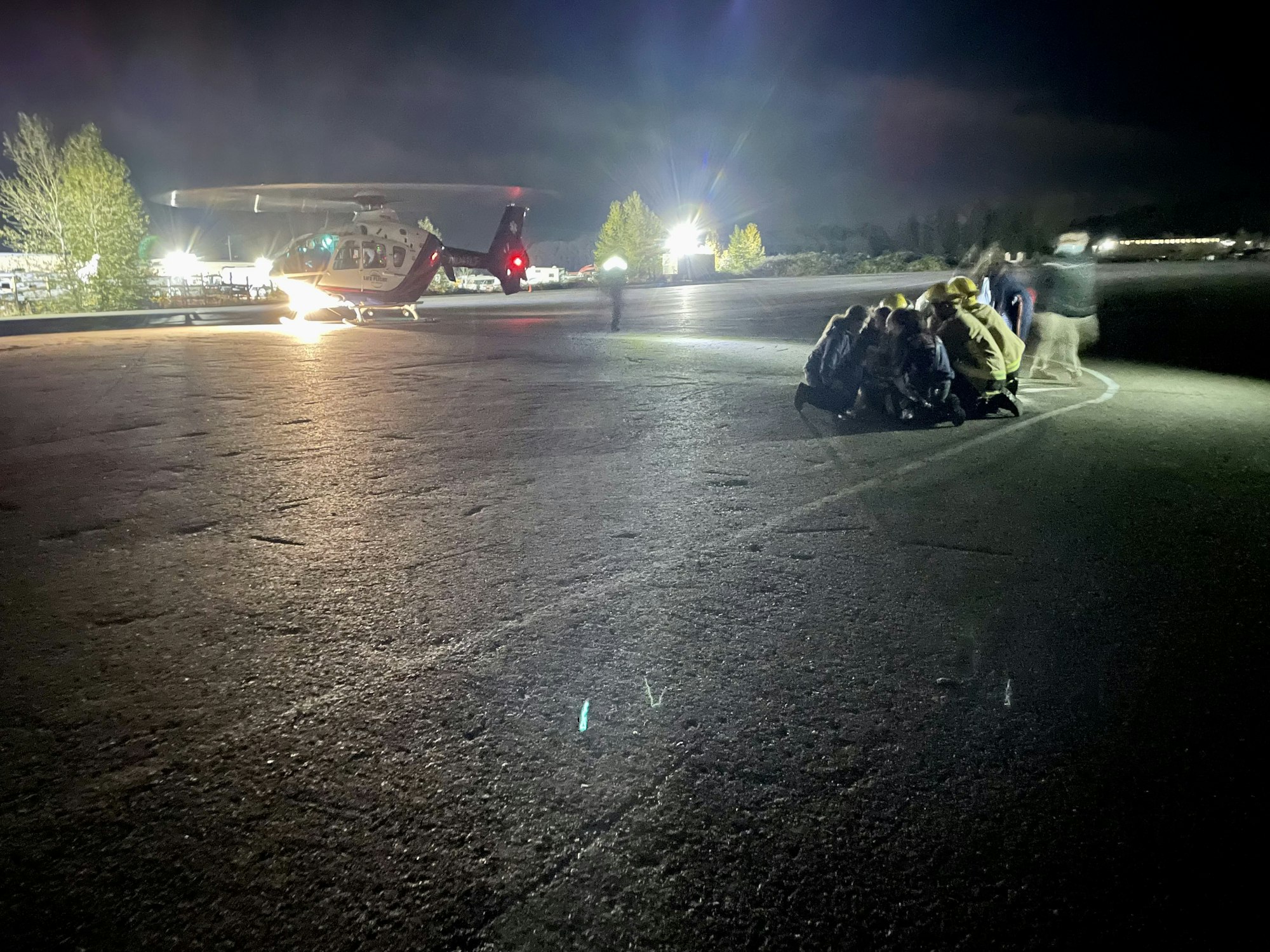 May contain: tarmac, asphalt, person, human, flare, and light