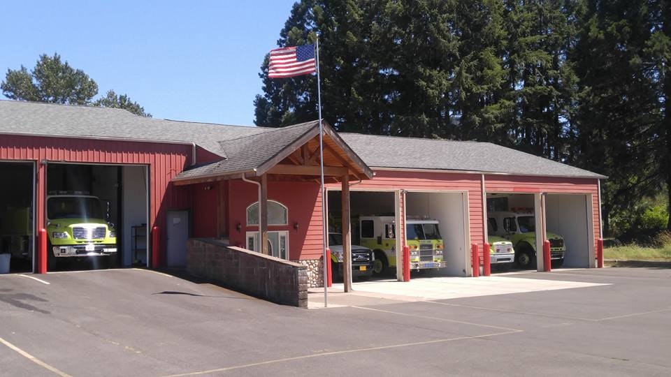 May contain: Fire station with bay doors opened