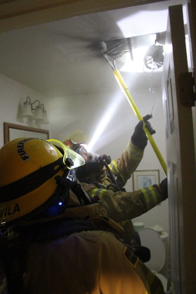 May contain: apparel, helmet, clothing, human, person, and fireman