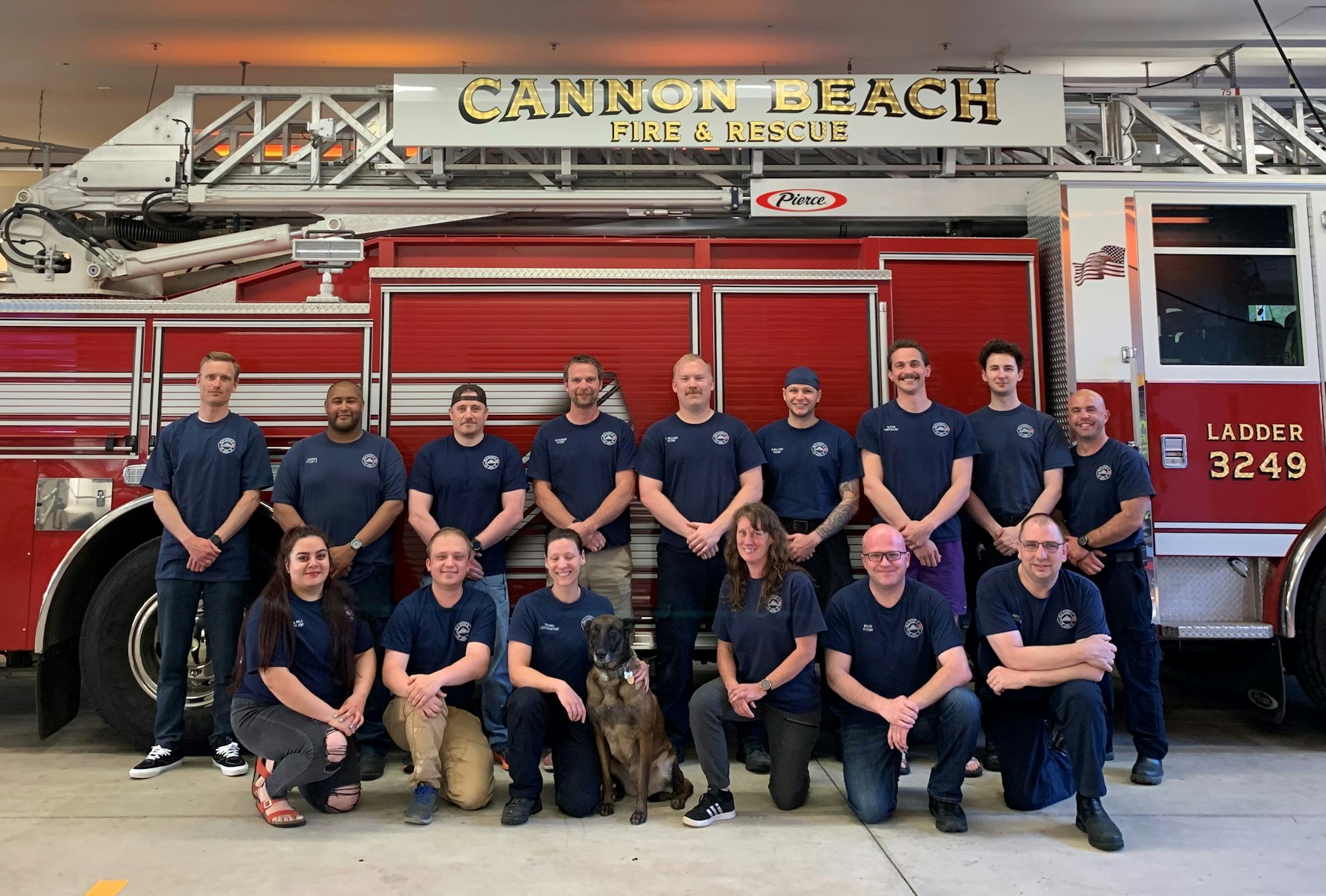 May contain: clothing, footwear, shoe, wristwatch, person, adult, male, man, accessories, glasses, fire truck, transportation, truck, vehicle, people, animal, canine, dog, mammal, pet, and hat