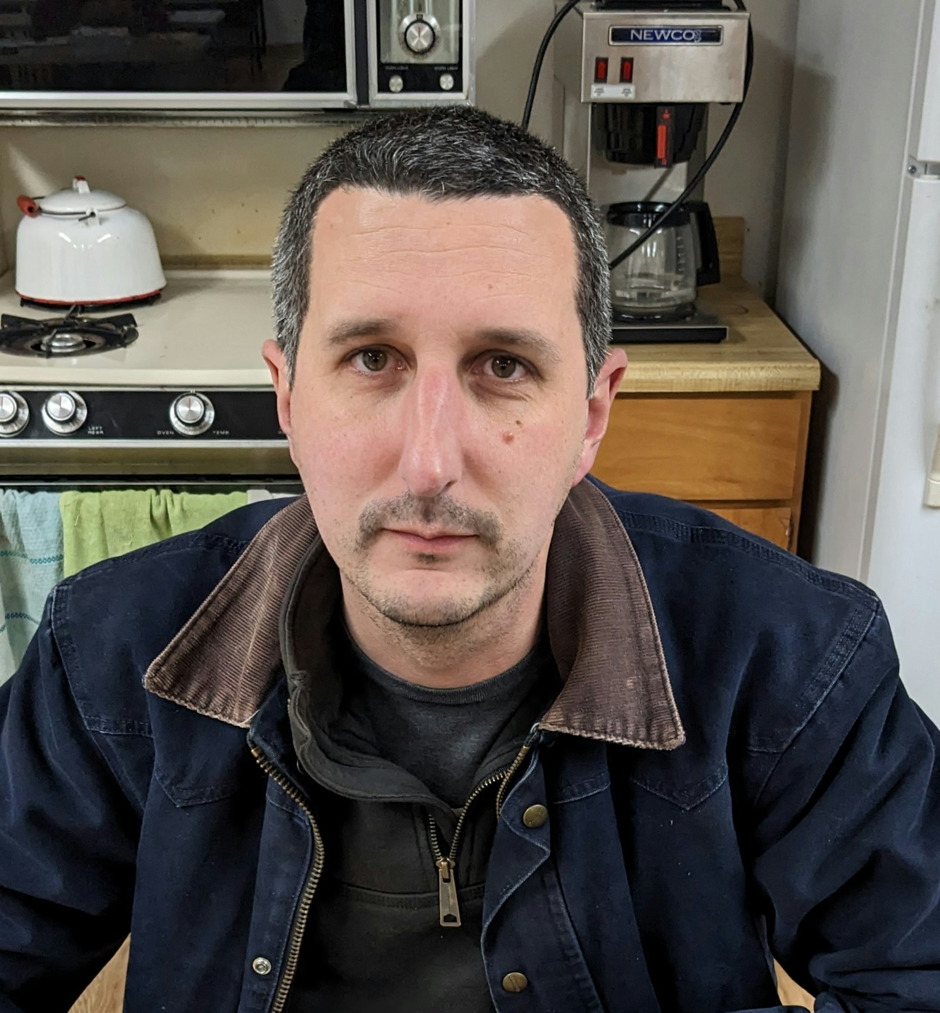 May contain: adult, male, man, person, crew cut, hair, face, and head
