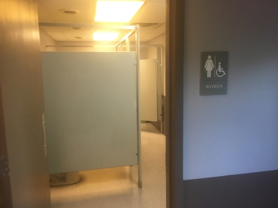 May contain: door, indoors, lighting, floor, flooring, dressing room, and room