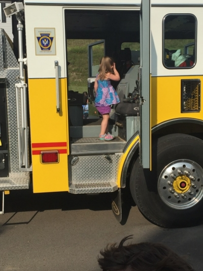 May contain: child, female, girl, person, machine, wheel, transportation, and vehicle