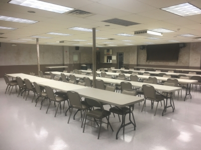 May contain: cafeteria, indoors, restaurant, architecture, building, school, people, person, classroom, and room