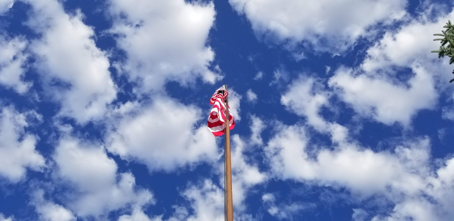 May contain: flag, nature, outdoors, and sky