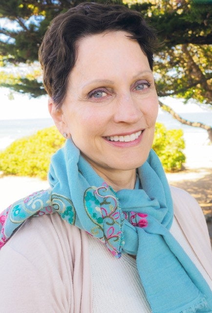 May contain: scarf, clothing, portrait, person, head, face, photography, woman, adult, female, smile, and happy