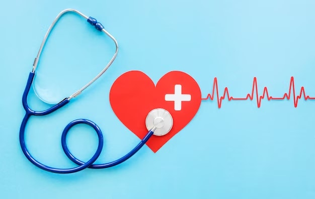 A stethoscope, a red heart with a cross, and an ECG line on a blue background.