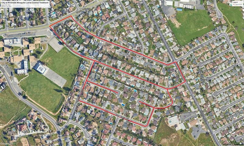 Aerial view of a neighborhood with red lines marking a path or boundary.