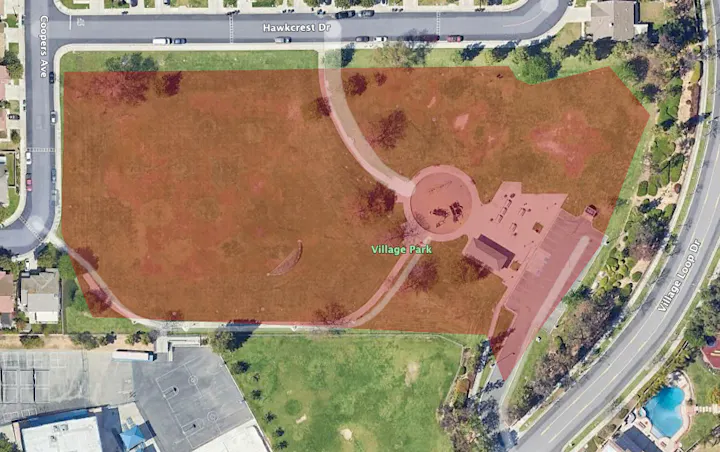 The image shows an aerial view of Village Park, highlighting park areas and nearby streets in a residential neighborhood.