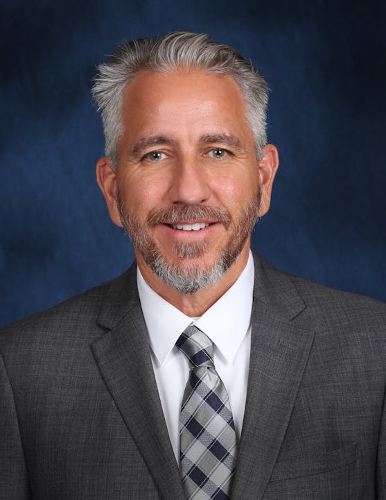 May contain: accessories, formal wear, tie, necktie, clothing, suit, adult, male, man, person, face, and head