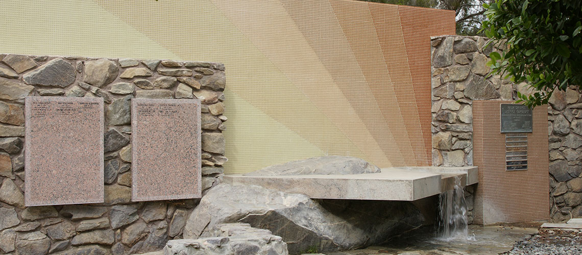 May contain: slate, wall, building, architecture, rock, walkway, path, flagstone, fountain, water, and rubble