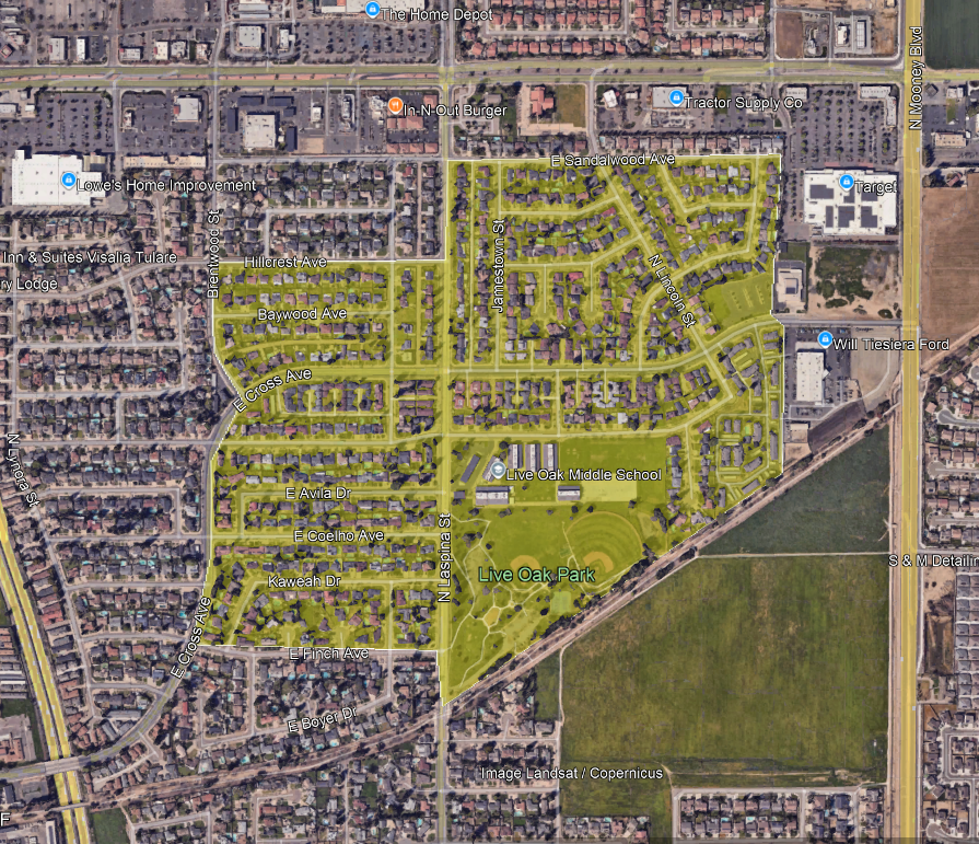 Aerial view of a neighborhood with streets, Live Oak Park, Live Oak Middle School, and nearby businesses like Lowe’s and Target.