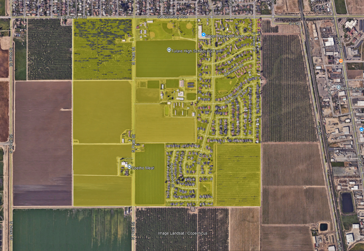 Aerial view of agricultural fields, residential areas, streets, and labeled locations.