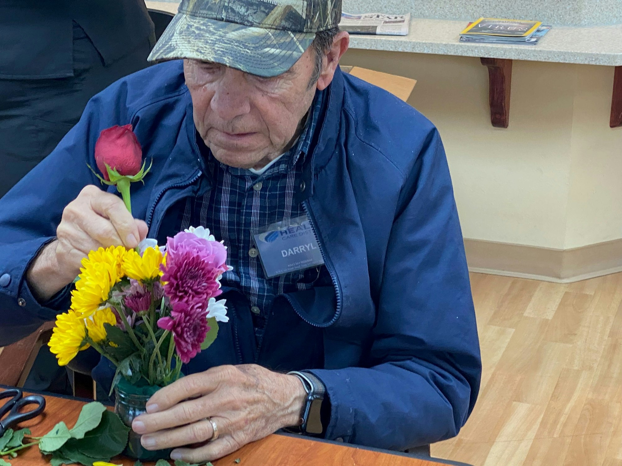 May contain: flower, flower arrangement, plant, accessories, jewelry, ring, flower bouquet, adult, male, man, and person