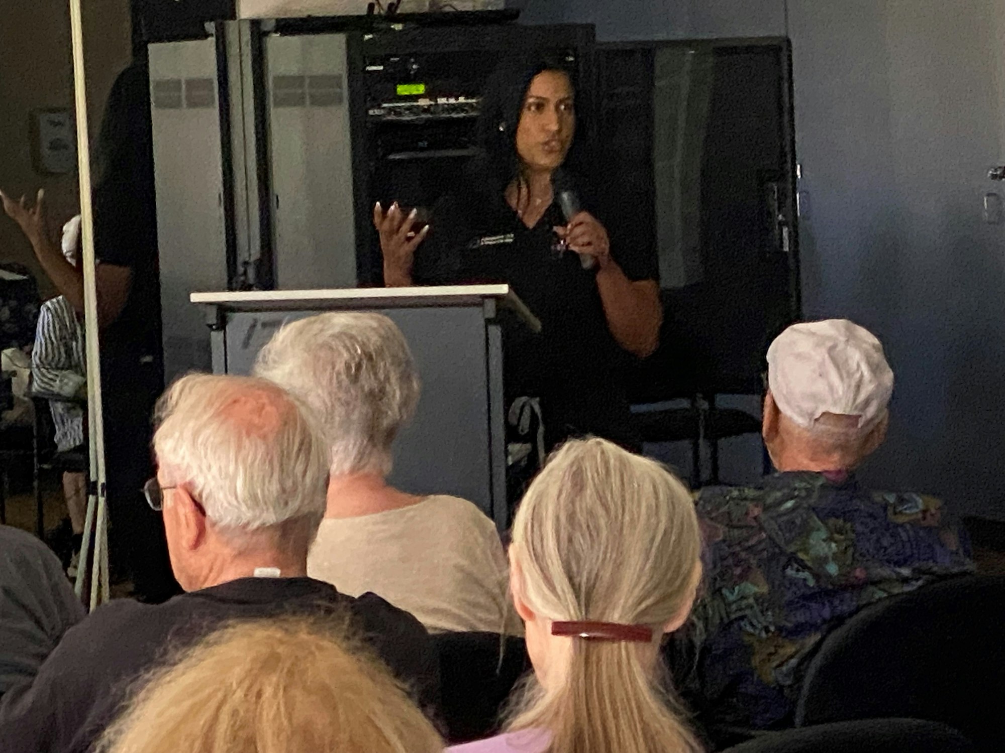 A speaker presenting to an audience.
