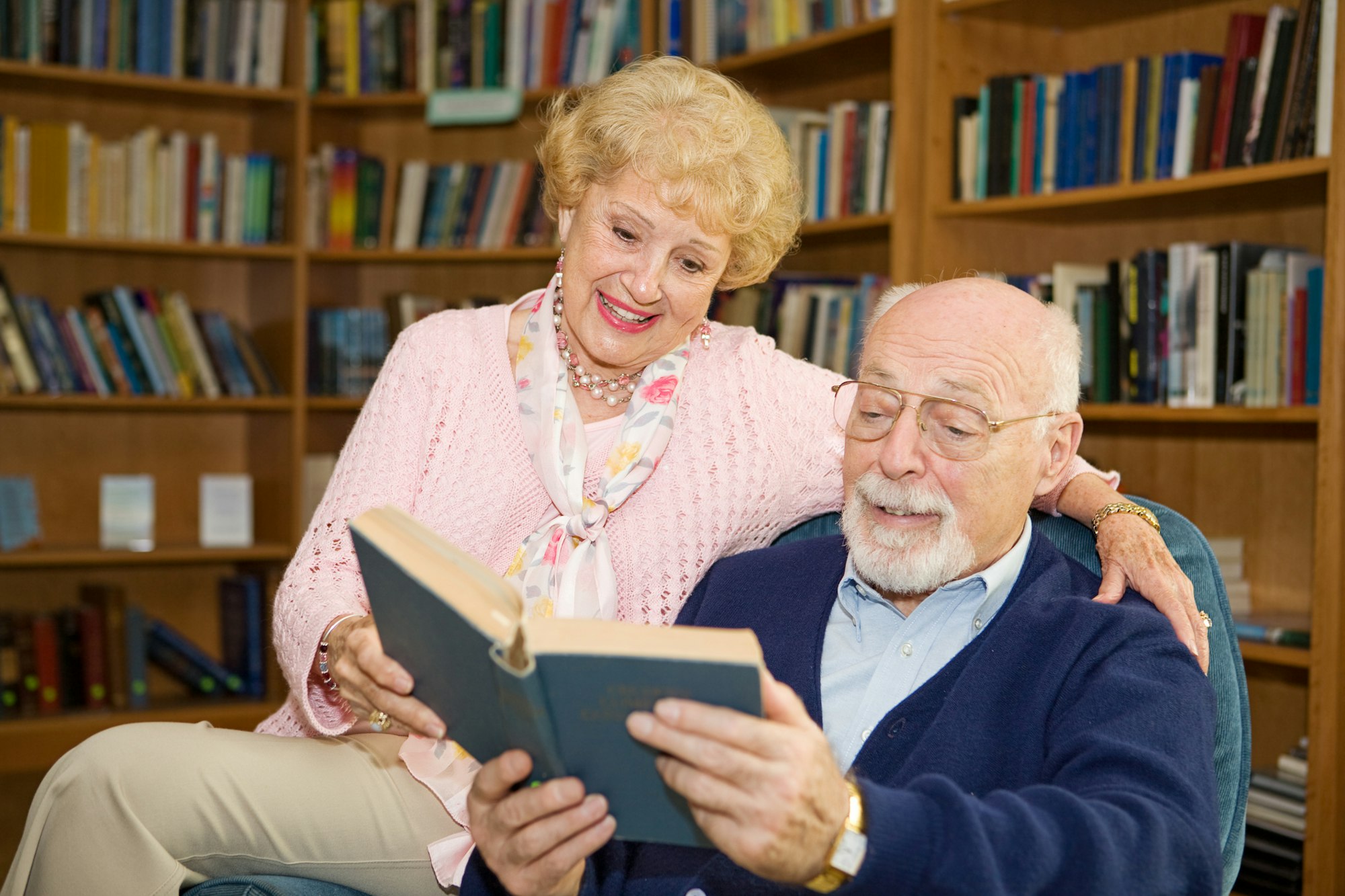 May contain: shelf, furniture, human, person, bookcase, and senior citizen