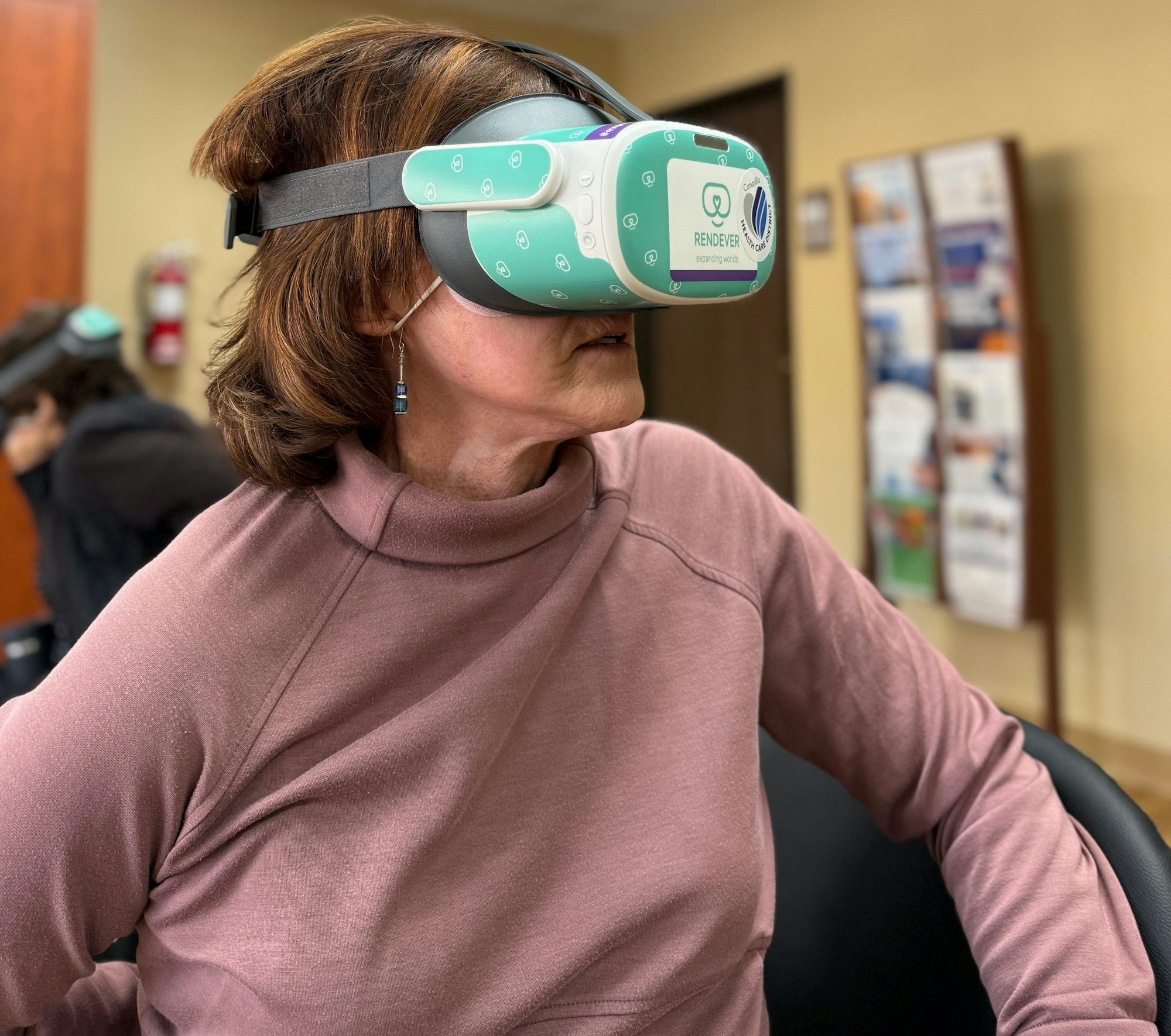 A person wearing a VR headset in an indoor setting.