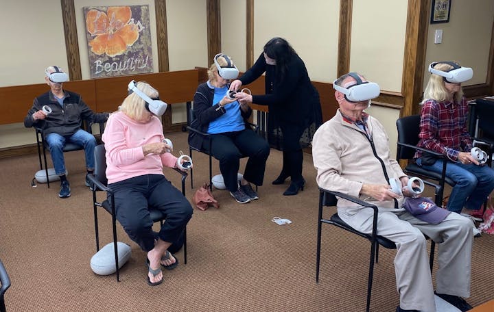 May contain: people, person, vr headset, accessories, bag, and handbag