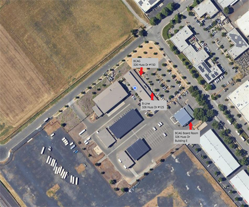 An aerial view of a commercial area with labeled locations: BCAC, B-Line, and BCAC Board Room, showing buildings and parking lots.