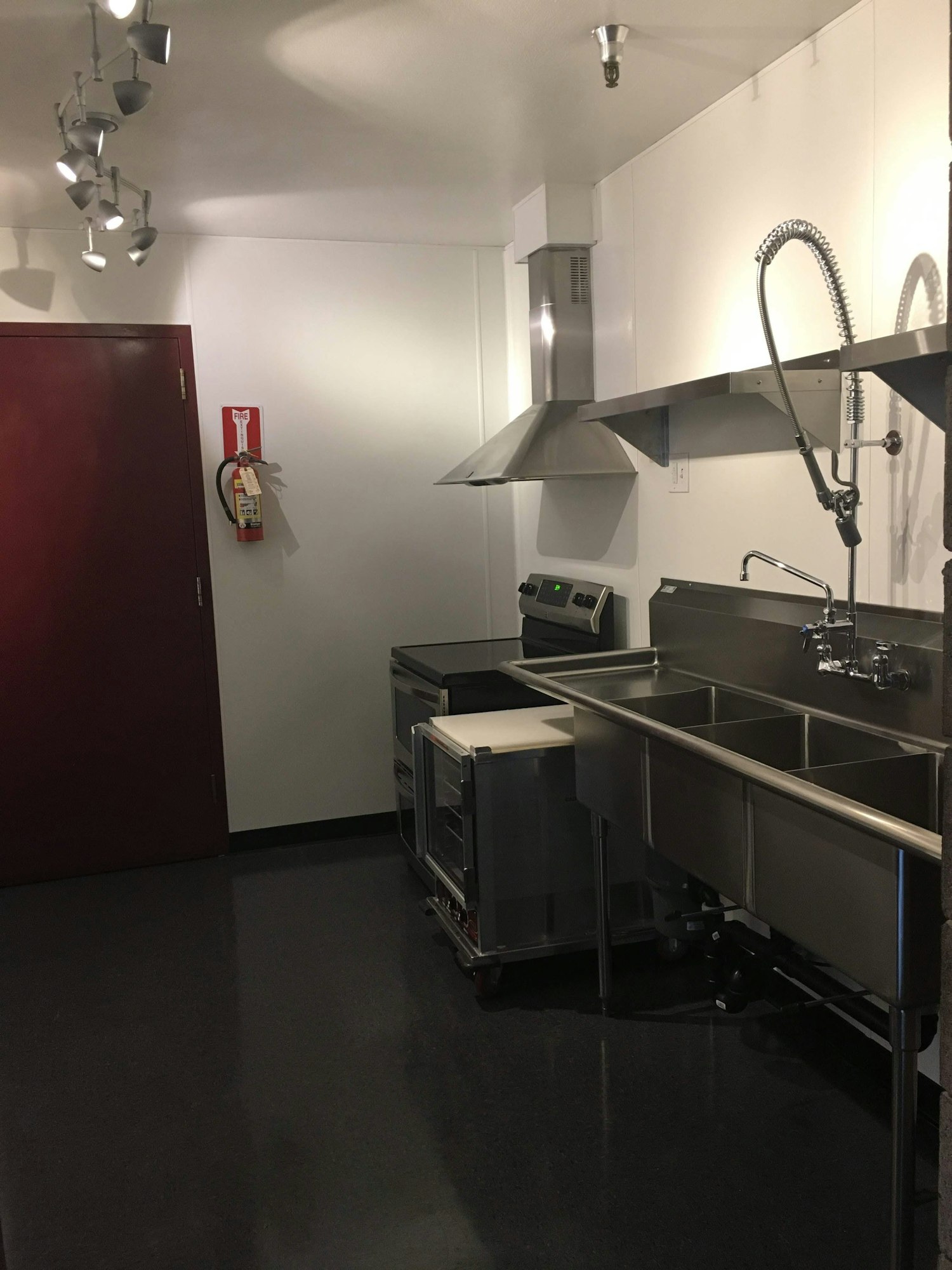 Kitchen sink, stove, and food warmer