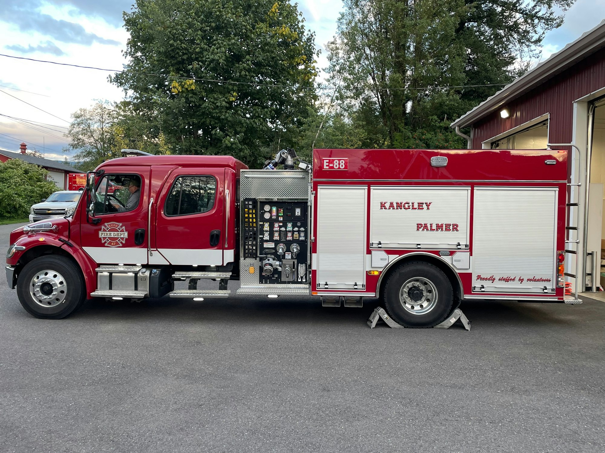 May contain: transportation, vehicle, truck, person, fire truck, and car