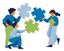 Four people assembling large puzzle pieces.