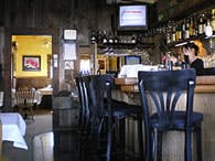 May contain: pub, alcohol, bar, bar counter, beverage, indoors, restaurant, dining table, furniture, table, computer hardware, electronics, hardware, monitor, and screen