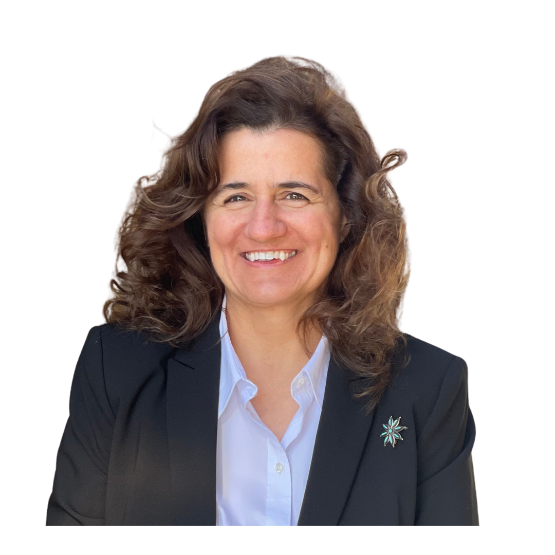 A person smiling, wearing a suit with a pin, white background.