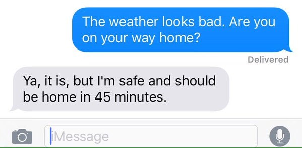 A text conversation about bad weather and someone confirming they are safe and will be home soon.