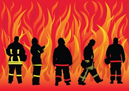 Silhouettes of firefighters against fiery background.