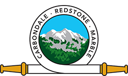A seal with a mountain, trees, and text "Carbondale • Redstone • Marble" with a golden scroll beneath it.