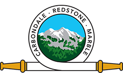 A seal with a mountain, trees, and text "Carbondale • Redstone • Marble" with a golden scroll beneath it.