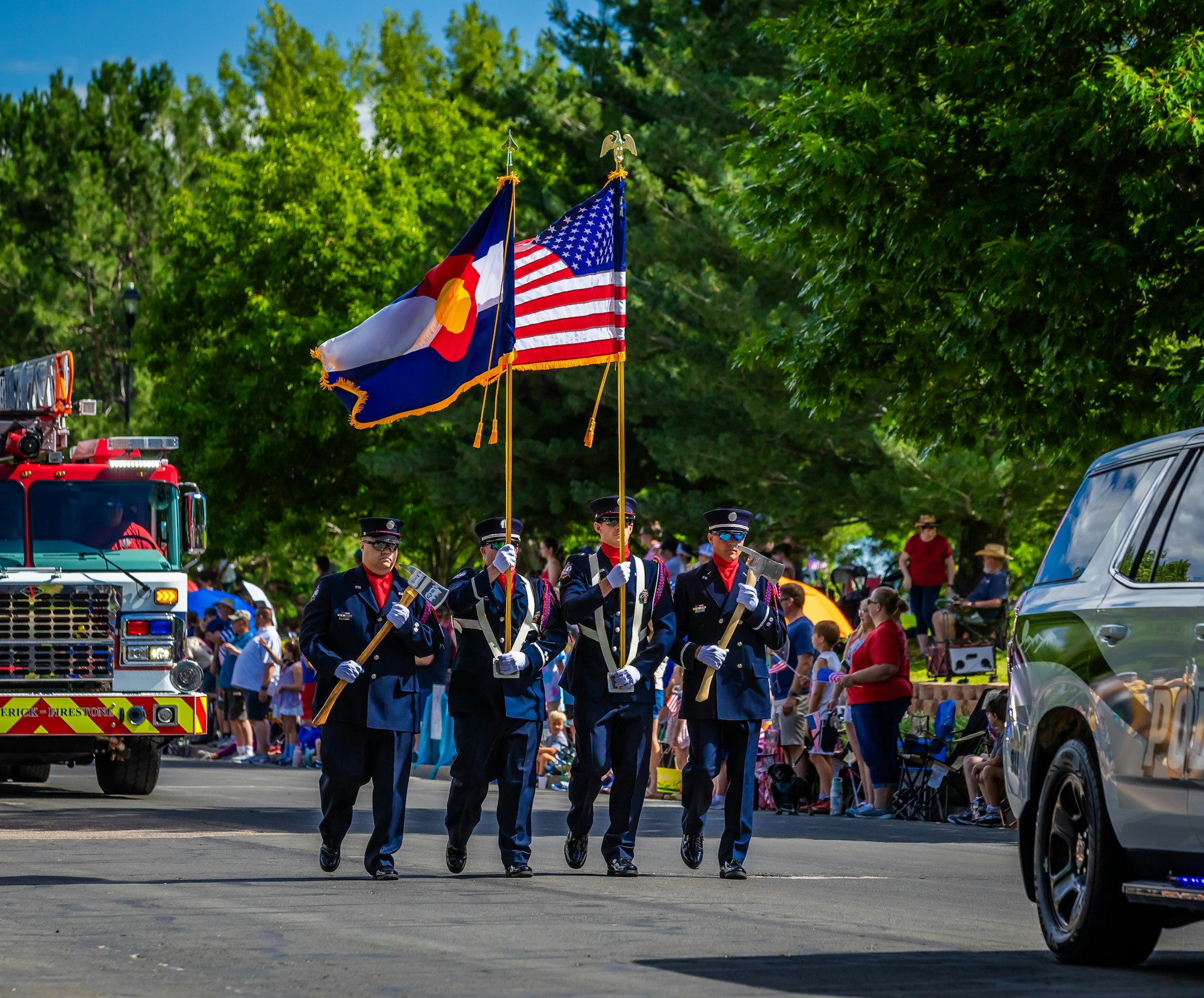 The Frederick-Firestone Fire District Color Guard walks in the 4th of July Parade in Firestone.