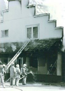 Firefighters extinguishing a house fire.