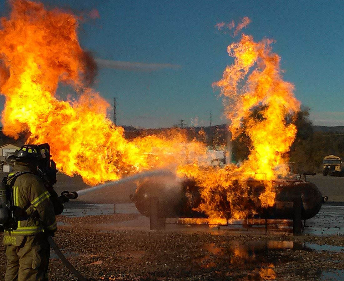 Firefighter training, extinguishing a large blaze.