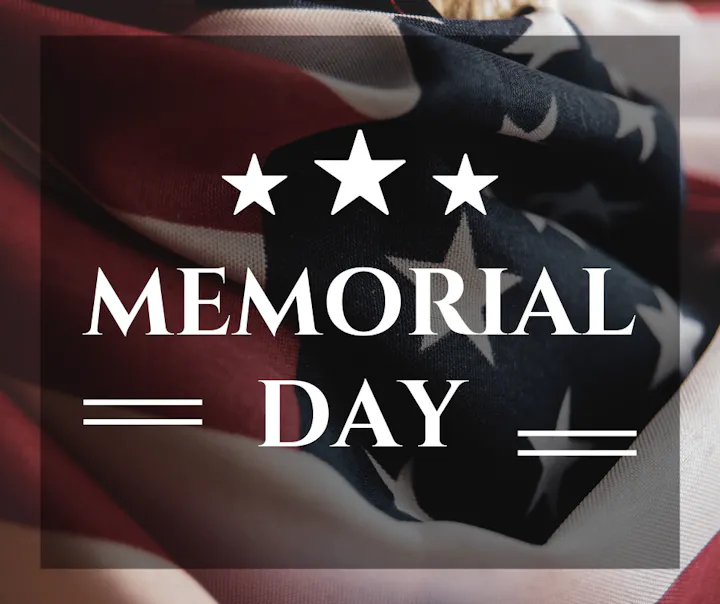 An artistic display featuring the words "Memorial Day" over a backdrop of the American flag, highlighting the holiday's significance.