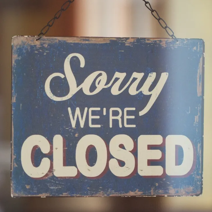 IMAGE OF A SIGN SAYING SORRY WE'RE CLOSED