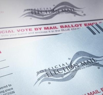 The image shows official mail-in ballots for voting, featuring instructions and a design with “Election Mail” prominently displayed.