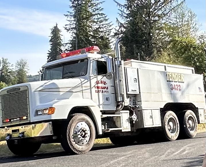 A fire tender truck is on a road, possibly associated with emergency response, marked with the word "TENDER" and the number 3432.
