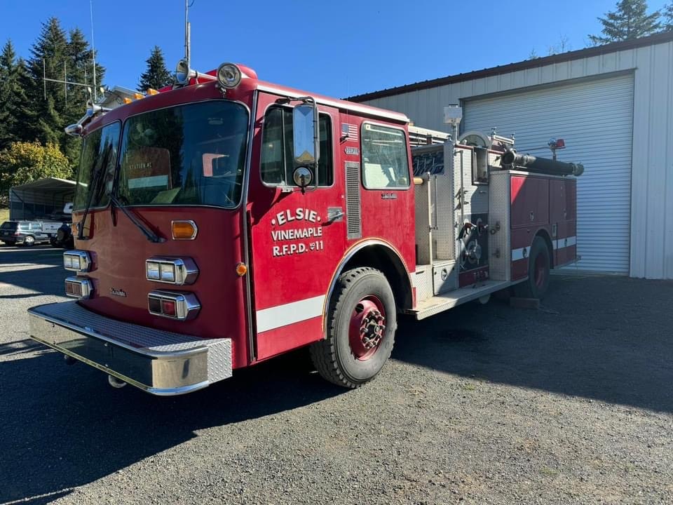 A red fire truck parked outside a building.