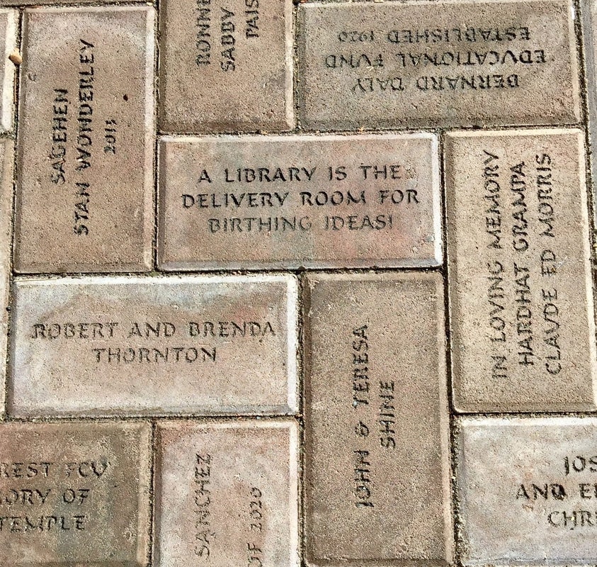 May contain: brick, book, publication, and path