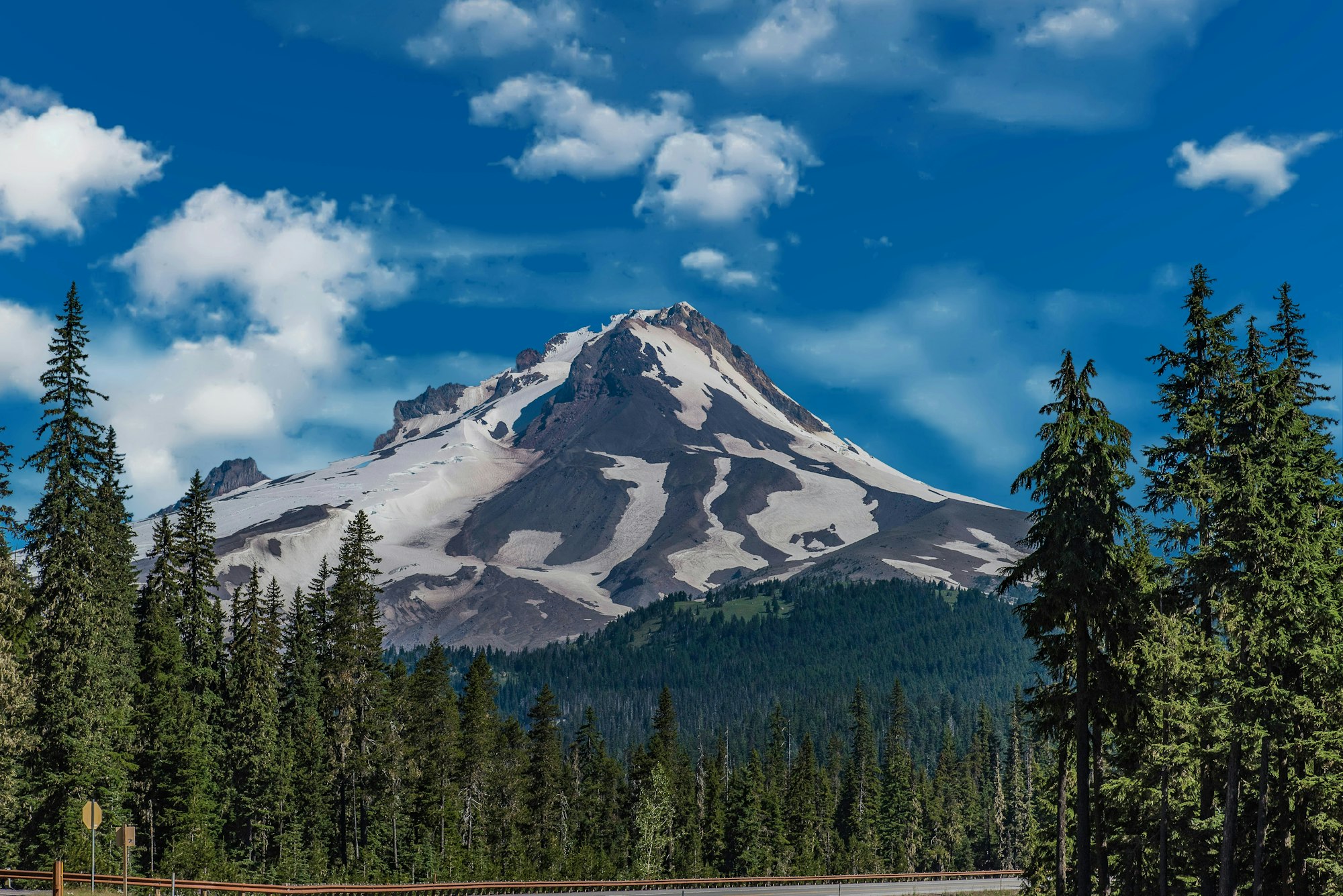 May contain: fir, plant, tree, conifer, mountain, mountain range, nature, outdoors, pine, scenery, peak, and spruce