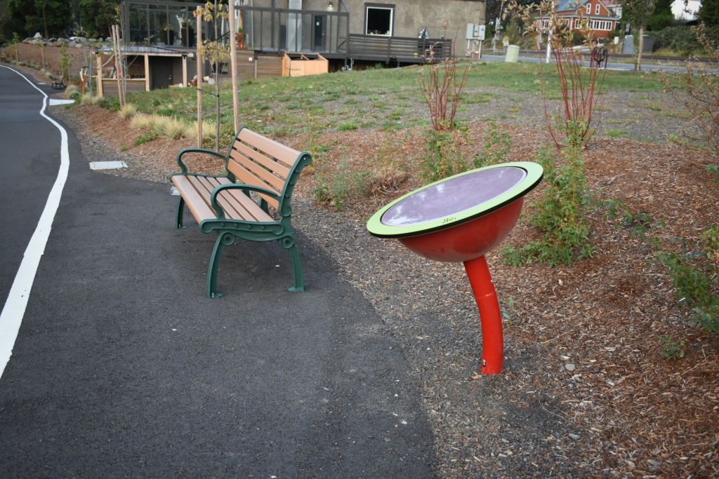 May contain: bench, furniture, road, tarmac, city, street, and urban